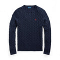 Navy cable knit sweater with red logo on a white background
